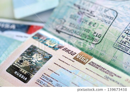 Fragment of Russian Federation visa in passport page. Concept of travel and tourism worldwide Fragment of Russian Federation visa in passport page. Concept of travel and tourism worldwide 139673438