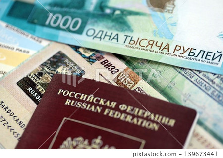 Fragment of Russian Federation visa in passport page and russian money Fragment of Russian Federation visa in passport page and russian money 139673441