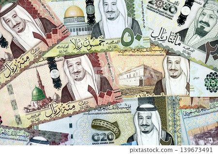 Saudi Arabia riyal money bills banknotes lies in big pile on table. Business in Saudi Arabia Saudi Arabia riyal money bills banknotes lies in big pile on table. Business in Saudi Arabia 139673491