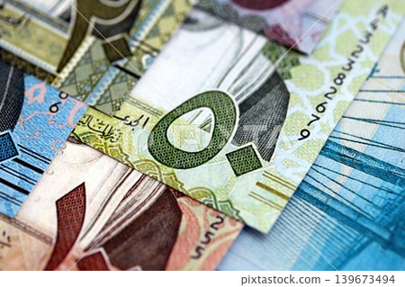 Saudi Arabia riyal money bills banknotes lies in big pile on table. Business in Saudi Arabia Saudi Arabia riyal money bills banknotes lies in big pile on table. Business in Saudi Arabia 139673494