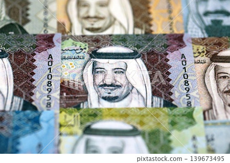 Saudi Arabia riyal money bills banknotes lies in big pile on table. Business in Saudi Arabia Saudi Arabia riyal money bills banknotes lies in big pile on table. Business in Saudi Arabia 139673495