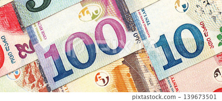 Georgian Lari currency money bills in heap. GEL currency banknotes Georgian Lari currency money bills in heap. GEL currency banknotes 139673501