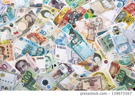 Different various money banknotes from many currencies of the whole world. Big pile of money bills Different various money banknotes from many currencies of the whole world. Big pile of money bills 139673567