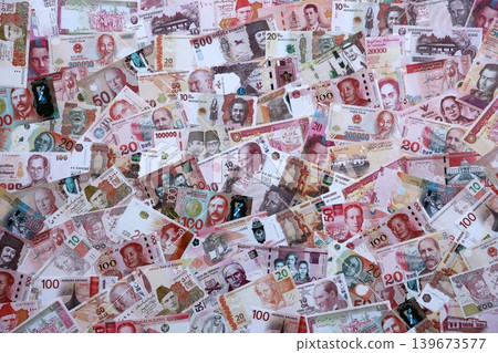 Various currencies money bills banknotes in red color. Many cash bills Various currencies money bills banknotes in red color. Many cash bills 139673577