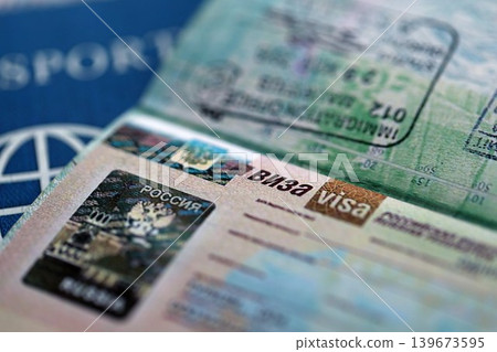 Fragment of Russian Federation visa in passport page close up. Concept of travel and tourism 139673595
