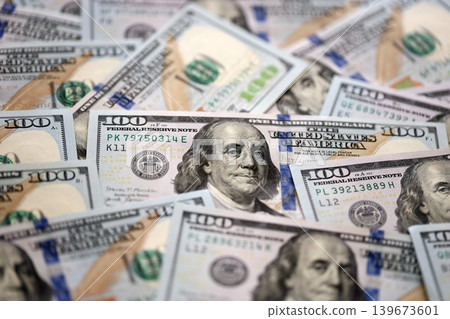 Stack of dollars and cash with a money background. US money and banknotes Stack of dollars and cash with a money background. US money and banknotes 139673601