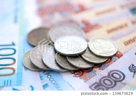 Coins and banknotes of Russian Federation ruble currency. Russia RUB money close up. Business Coins and banknotes of Russian Federation ruble currency. Russia RUB money close up. Business 139673629