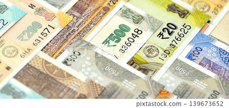Big pile of Indian Rupees money bills banknotes close up. Lots of money of Indian INR currency cash Big pile of Indian Rupees money bills banknotes close up. Lots of money of Indian INR currency cash 139673652