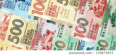 Big pile of Hong Kong dollars money bills banknotes. Lots of money of Chinese Hong Kong HKD cash Big pile of Hong Kong dollars money bills banknotes. Lots of money of Chinese Hong Kong HKD cash 139673653