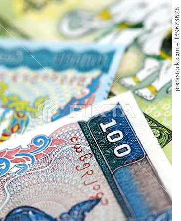 Myanmar kyat paper banknotes pile on table. Myanmar MMK currency money bills in big amount Myanmar kyat paper banknotes pile on table. Myanmar MMK currency money bills in big amount 139673678