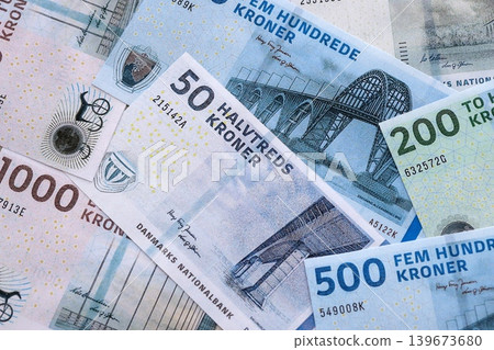 Danish krone paper banknotes pile on table. Denmark DKK currency money bills in big amount 139673680