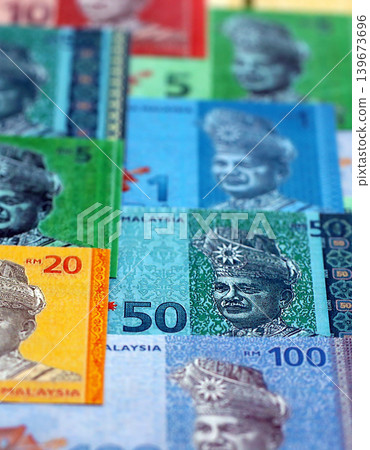 Malaysian ringgit paper banknotes pile on table. Malaysia MYR currency money bills in big amount 139673696