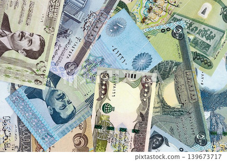 Iraqi dinar paper banknotes pile on table. Iraq IQD currency money bills in big amount 139673717