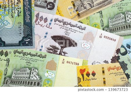 Yemeni rial paper banknotes pile on table. Yemen YER currency money bills in big amount 139673723