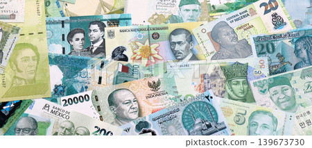 Various currencies money bills banknotes in green color. Many cash bills Various currencies money bills banknotes in green color. Many cash bills 139673730