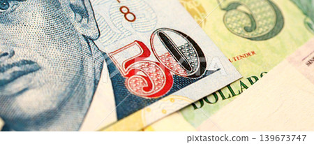 Singapore Dollar currency money bills. SGD currency banknotes in stack Singapore Dollar currency money bills. SGD currency banknotes in stack 139673747