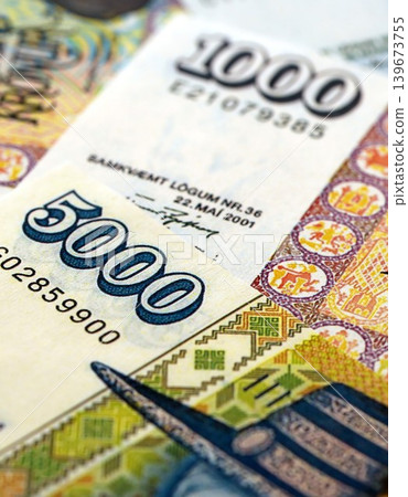 Icelandic krona money bills pile on table. Iceland banknotes of ISK currency close up Icelandic krona money bills pile on table. Iceland banknotes of ISK currency close up 139673755