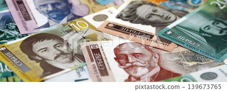 Serbian dinar money bills pile on table. Serbia banknotes of RSD currency. Concept of business Serbian dinar money bills pile on table. Serbia banknotes of RSD currency. Concept of business 139673765