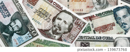 Cuban peso money bills pile on table. Cuba banknotes of CUP currency close up. Concept of business Cuban peso money bills pile on table. Cuba banknotes of CUP currency close up. Concept of business 139673768