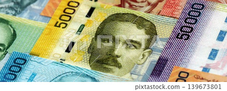 Costa Rican colon money bills pile on table. Costa Rica banknotes of CRC currency close up Costa Rican colon money bills pile on table. Costa Rica banknotes of CRC currency close up 139673801