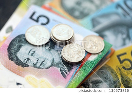 Australian dollar money bills and cent coins pile. Australia coins on banknotes of AUD currency 139673816