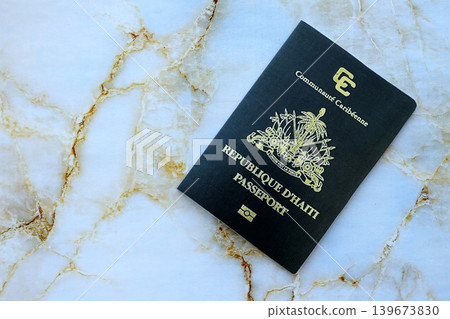 Haitian passport on table close up. Official identification document book for citizens of Haiti 139673830