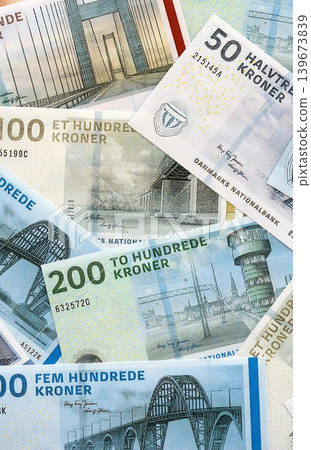 Danish krone paper banknotes pile on table. Denmark DKK currency money bills in big amount 139673839