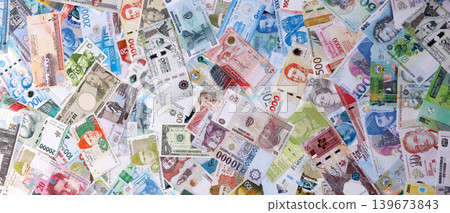 Money from different countries. Big amount of cash close up. Currency Exchange Money from different countries. Big amount of cash close up. Currency Exchange 139673843