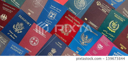 Big amount of passports of various different countries. Covers of expired passports close up Big amount of passports of various different countries. Covers of expired passports close up 139673844