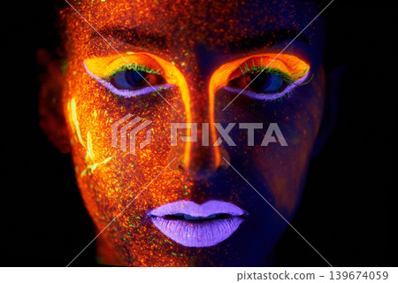 Portrait, art and beauty with neon woman on black background for makeup, glitter or colorful glow. Face, fantasy and creative with confident young person in the dark for psychedelic or techno paint 139674059
