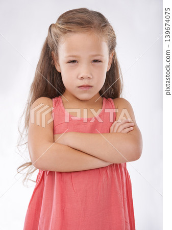 Angry, girl and child in studio with arms crossed, frustrated in portrait and emotion, cross or upset on white background. Facial expression, rage and conflict with tantrum, furious and bad attitude Angry, girl and child in studio with arms crossed, frustrated in portrait and emotion, cross or upset on white background. Facial expression, rage and conflict with tantrum, furious and bad attitude 139674075