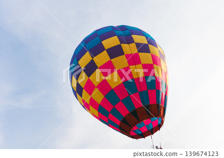 Colorful hot air balloon floating in blue sky 139674123