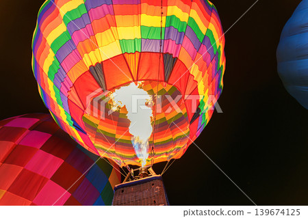 Colorful hot air balloon with flame burning in the night 139674125