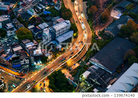 Bangkok city with skyscraper building and illuminated expressway and billboards in business district 139674140