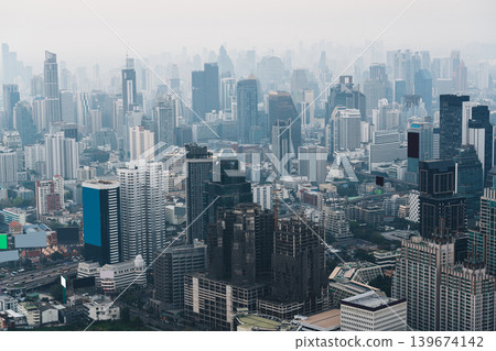 Cityscape of Bangkok wuth skyscraper and urban building in dust and smog during early morning 139674142