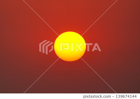 Golden yellow sun glowing on clear warm sky 139674144
