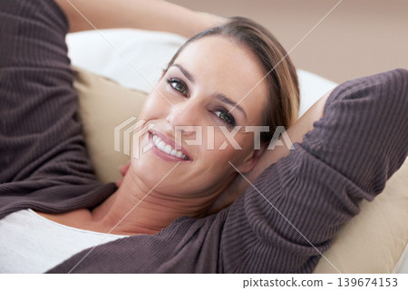 Woman, relax and portrait in living room couch for positive, satisfaction and mindset. Happiness, calm and weekend with female person, home and joy, carefree and comfortable alone in sofa for rest 139674153