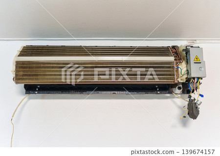 Remove and cleaning dirty air conditioner with dust covered fan blades and coils Remove and cleaning dirty air conditioner with dust covered fan blades and coils 139674157