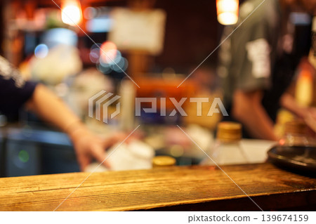 Wooden tabletop of traditional Izakaya restaurant blurred scene Wooden tabletop of traditional Izakaya restaurant blurred scene 139674159