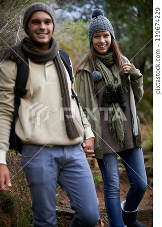 Couple, portrait and hiking in forest with holding hands for travel, adventure or wellness and fitness. Man, woman and trekking outdoor in woods for cardio, exercise or workout with happy or backpack Couple, portrait and hiking in forest with holding hands for travel, adventure or wellness and fitness. Man, woman and trekking outdoor in woods for cardio, exercise or workout with happy or backpack 139674229