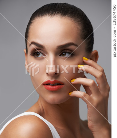 Face, beauty and manicure nails with woman in studio isolated on gray background for luxury cosmetology. Thinking, makeup and lipstick with confident young model at salon for aesthetic cosmetics 139674450