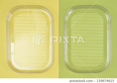 Two transparent plastic trays on split background Two transparent plastic trays on split background 139674625