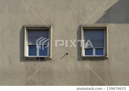 Windows with Roller Shutters on a Building Facade Windows with Roller Shutters on a Building Facade 139674635