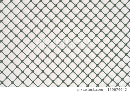 Diagonal pattern of green plastic garden mesh Diagonal pattern of green plastic garden mesh 139674642
