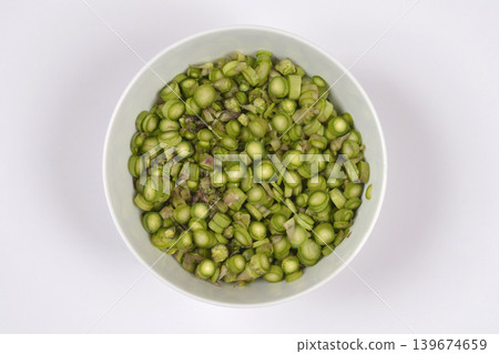 Chopped Green Asparagus in a White Bowl 139674659