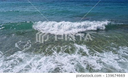 Sea Wave Breaking on Pebble Beach Sea Wave Breaking on Pebble Beach 139674669