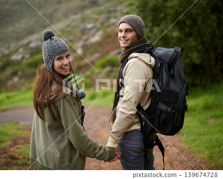Happy couple, hiking on mountains and holding hands for outdoor adventure, travel journey and portrait. Young man and woman with love, eco friendly date and walking or trekking in backpack for winter Happy couple, hiking on mountains and holding hands for outdoor adventure, travel journey and portrait. Young man and woman with love, eco friendly date and walking or trekking in backpack for winter 139674728