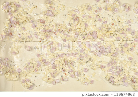 Puff pastry rolls preparation with cheese and ham Puff pastry rolls preparation with cheese and ham 139674968