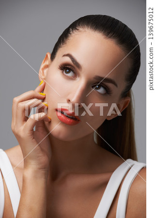 Beauty salon, manicure and face of studio woman thinking of facial cosmetics, skincare or nail paint treatment. Nailpolish, clean hands and cosmetology model planning makeup idea on grey background Beauty salon, manicure and face of studio woman thinking of facial cosmetics, skincare or nail paint treatment. Nailpolish, clean hands and cosmetology model planning makeup idea on grey background 139675012