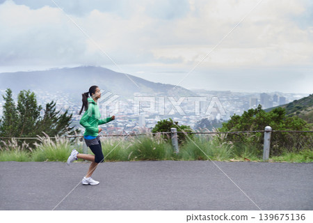 Training, road and running with woman, fitness and morning with fresh air and exercise for health, workout and cardio. Person, runner and athlete with wellness and practice with energy and challenge 139675136